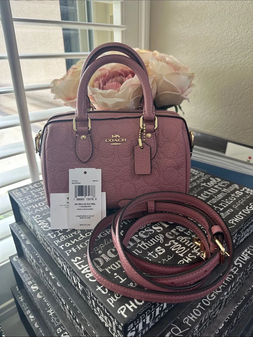Coach mini Rowan signature leather in the color peony